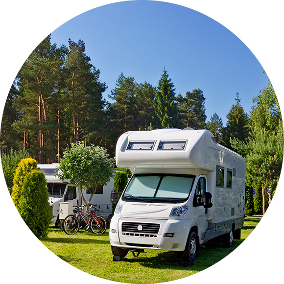Motor homes parked up in woods to promote Much Ado About Insurance Brokers - Home and Caravan Insurance